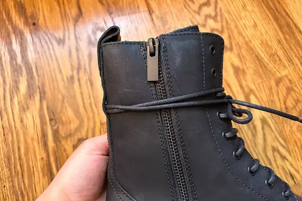 The laces on the Thursday Boot Co. Quest Boot wrapped around the zipper