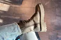A person wearing the Thursday Boot Co. Quest Boots