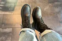 A person wears the Thursday Boot Co. Quest Boots