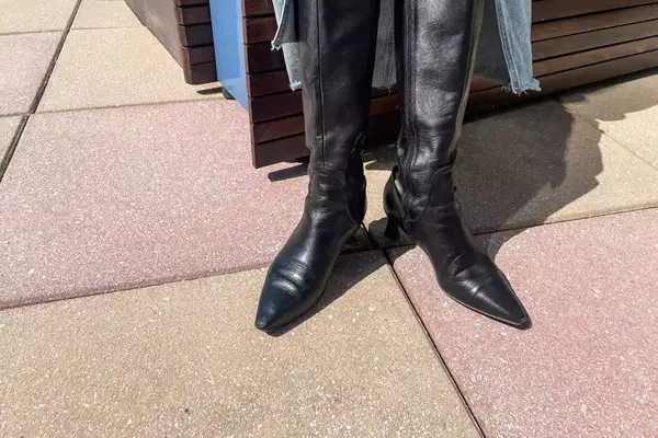 A person wears the Naturalizer Deesha Knee High Boots