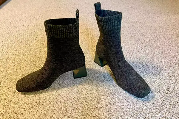A pair of Vivaia Regina Pro Square-Toe Water-Repellent Heeled Boots on a rug