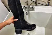 A hand holds a Overland Women