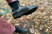 A person wears the Vivaia Regina Pro Square-Toe Water-Repellent Heeled Boots