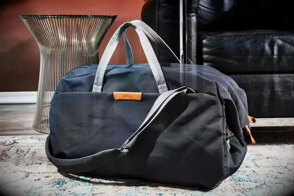 Patagonia Black Hole 40L Duffel Bag displayed on a sofa