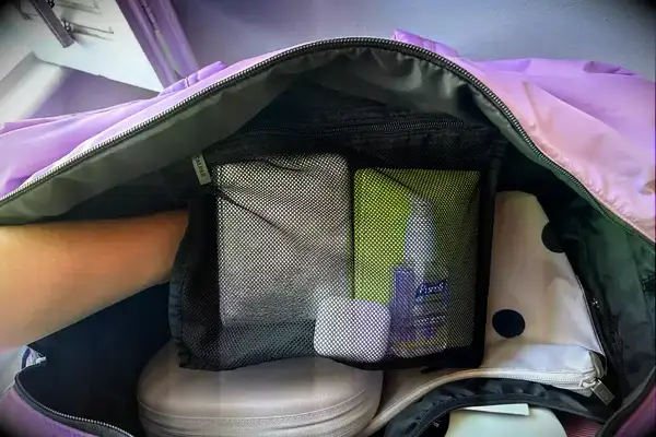 A close up of the mesh pocket inside the Calpak Luka Large Duffel