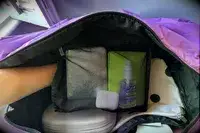 A close up of the mesh pocket inside the Calpak Luka Large Duffel