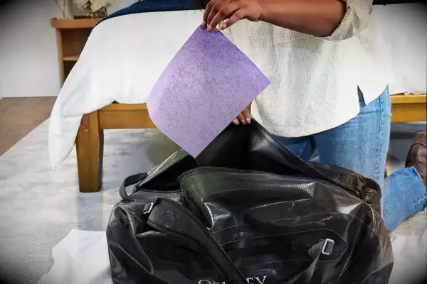 A piece of paper is removed from the Osprey Transporter Waterproof Duffel 70L