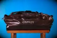 The Osprey Transporter Waterproof Duffel 70L is sprayed with water