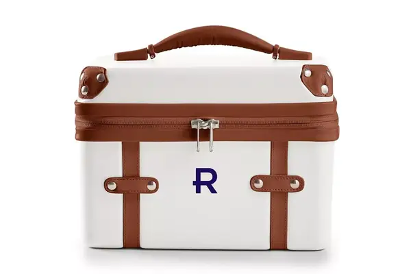 A person hits the Mark & Graham Terminal 1 Checked Rolling Duffle Bag with a bat