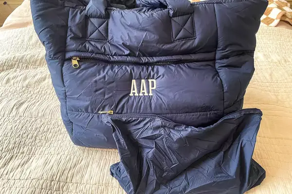 A navy puffer tote bag