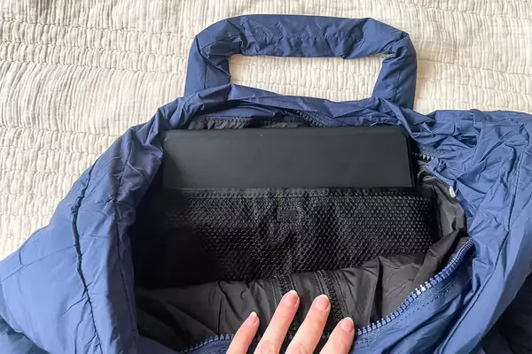 The inside of a navy puffer tote bag