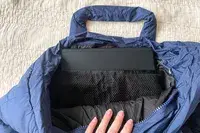 The inside of a navy puffer tote bag