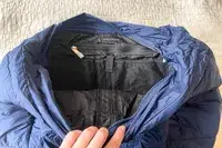 The inside of a navy puffer tote bag