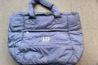 A navy puffer tote bag