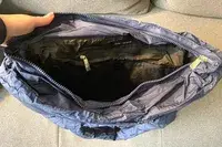 The inside of a navy puffer tote bag