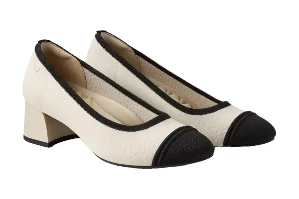 The back side of the Nine West Kuna 9x9 Pointy Toe Pumps on a person