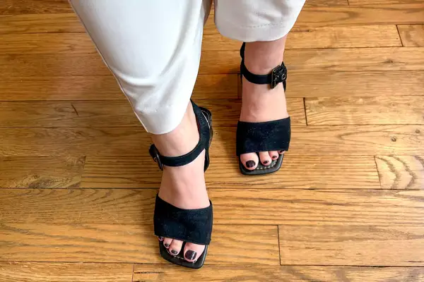 A person wearing the Donald Pilner Aaro Sandals