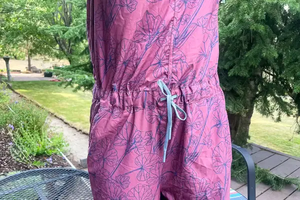 Closeup of a Flylow Tucker Jumpsuit outdoors on a deck