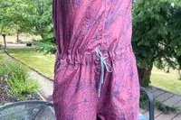 Closeup of a Flylow Tucker Jumpsuit outdoors on a deck