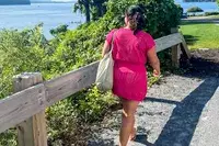 Woman walks near the water wearing a CupShe Crochet Mini Dress