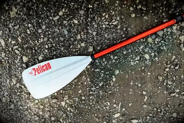 The Atoll 11-foot Inflatable Stand-up Paddle Board halfway in the water