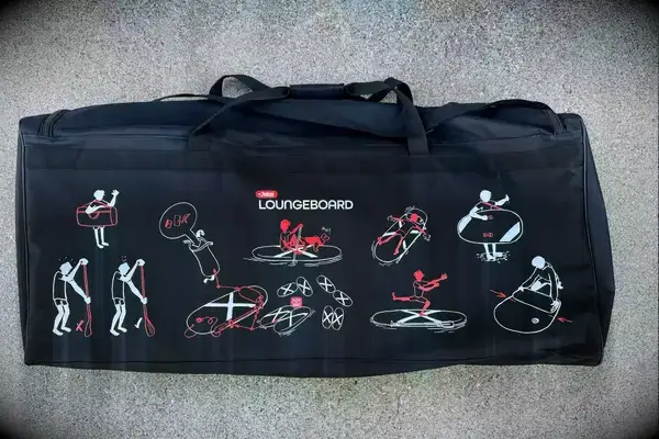 The Atoll 11-foot Inflatable Stand-up Paddle Board deflated on the floor with its accessories