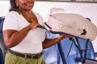 A person holds up the Bellroy Lite Daypack