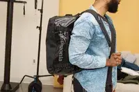 A person placing the Dagne Doverr Seattle Carry On Rolling Luggage 20.5