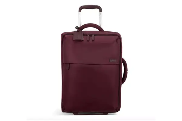 A person opening a packed Dagne Doverr Seattle Carry On Rolling Luggage 20.5