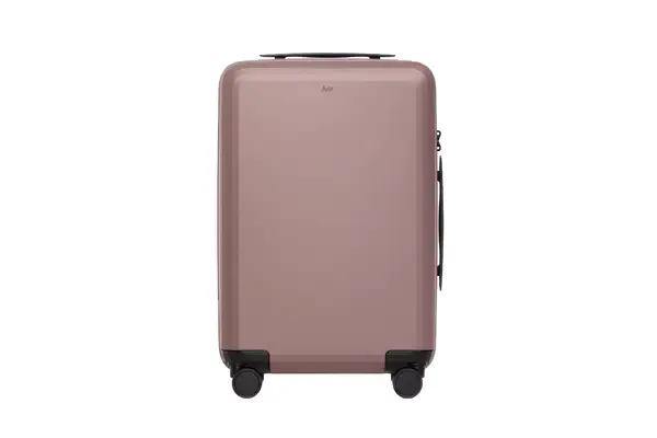 A person zippering the Dagne Doverr Seattle Carry On Rolling Luggage 20.5