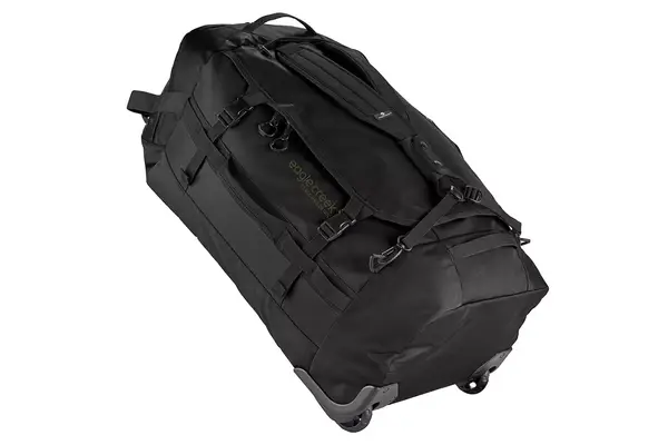 A person places the Dagne Dover Smaller Seattle Carry-on Luggage 20.5 Inches into an overhead compartment