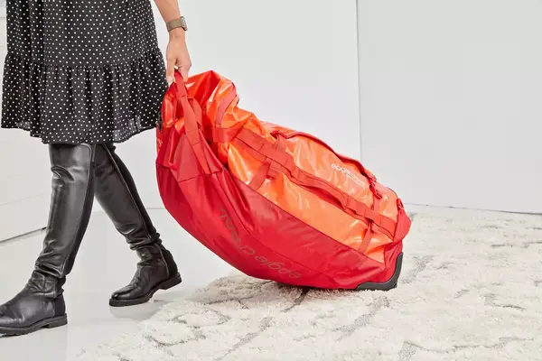 A person hits the Dagne Dover Smaller Seattle Carry-on Luggage 20.5 Inches with a baseball bat