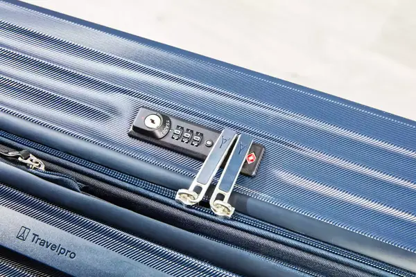 A close-up of the lock and zipper of the Travelpro Maxlite Air Medium Check-In Hardside Spinner