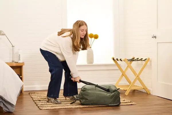 A person hits the Lipault Foldable Plume Cabin with a baseball bat