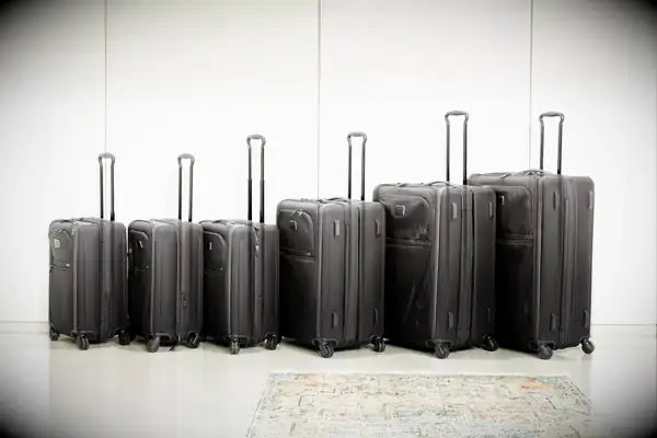 Six Tumi suitcases lined up