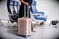 A person rolling the Tumi 19 Degree Carry-on