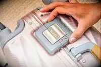 The latches on a Tumi suitcase