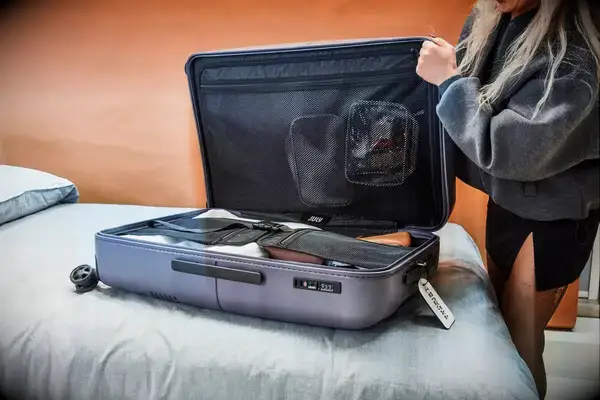 Person closing the July Checked Plus Light