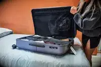 Person closing the July Checked Plus Light