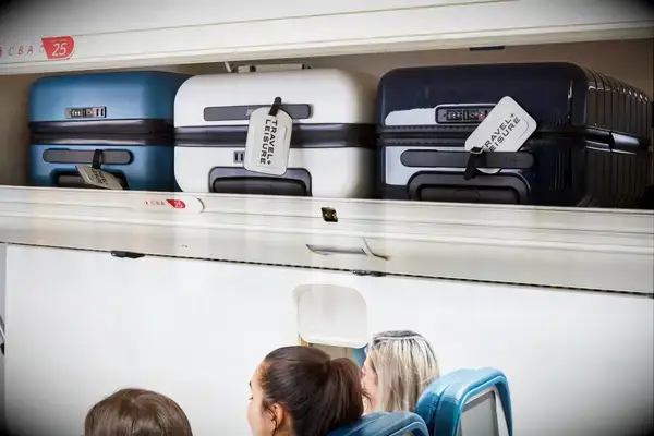 Luggage in an overhead bin on airplane