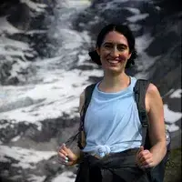 A person unzips the Samsonite 21 Inch Freeform Hardside Expandable Carry-on Spinner