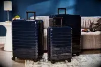 Set of three Away suitcases in room