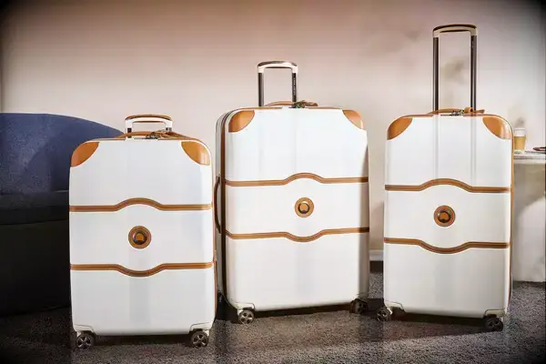 Three Delsey suitcases