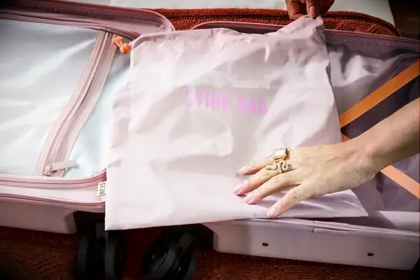 The laundry bag inside a Beis suitcase