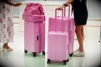 People rolling Beis luggage