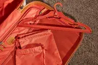 Hanger and storage bags from the Delsey Chatelet Air 2.0 21-inch Carry-on Spinner
