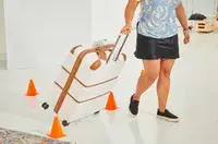 Delsey Paris Chatelet Air 2.0 28 Inch Large Checked Spinner being rolled through cones