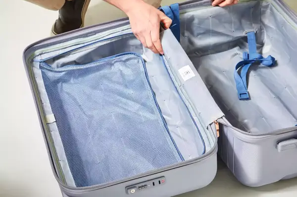 An opened, empty Delsey Paris Cruise 3.0 26 Inch Trunk