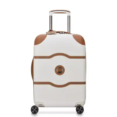 A woman tests the Delsey Paris Chatelet Air 2.0 Carry-on