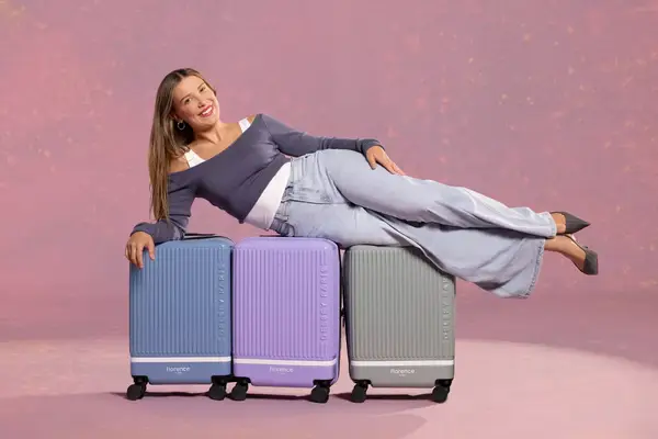 Millie Bobby Brown laying across florence by mills luggage